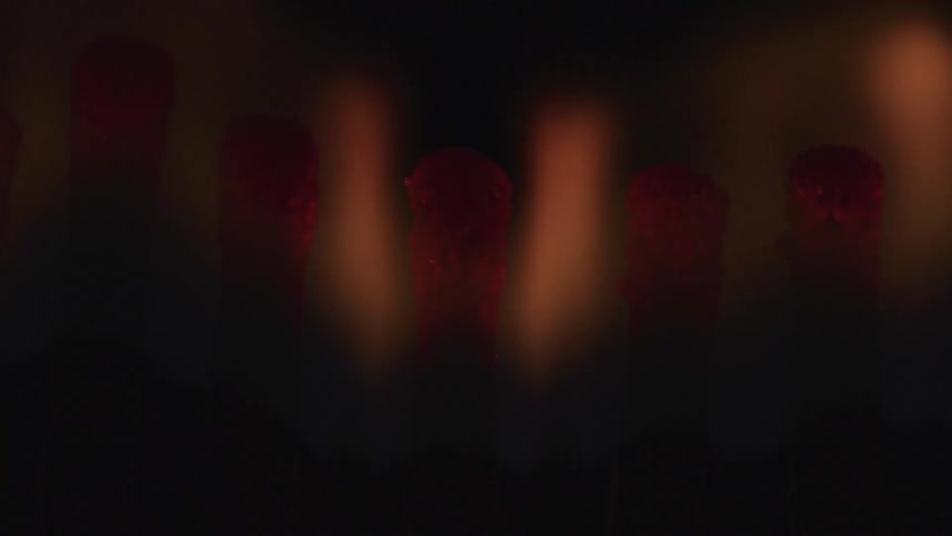 The lights flash on the strips of red paint