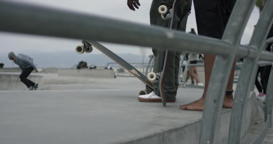 People at a skatepark near the beach during the day