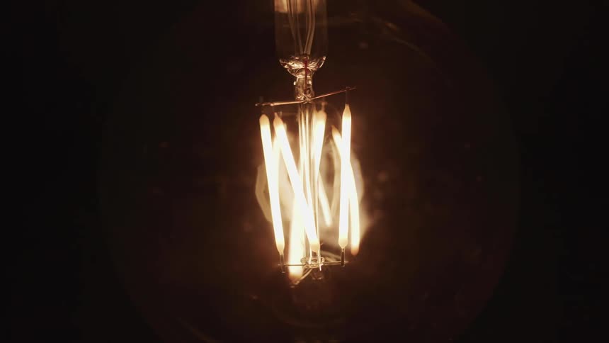 A light bulb flashes on and off