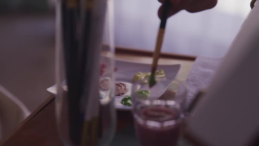 A person is painting indoors