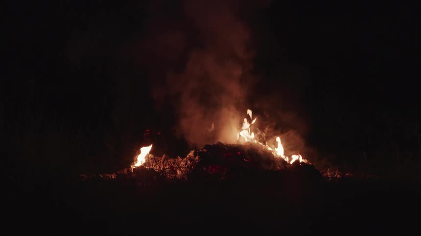 The brush is burning at night
