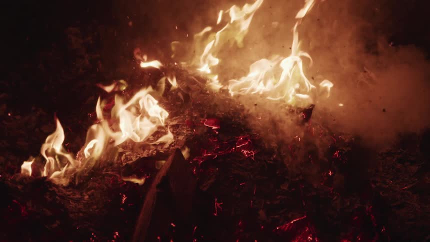 The brush is burning and giving off smoke