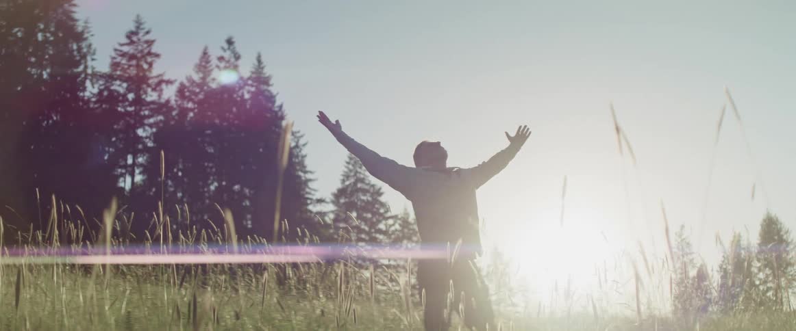 A man is stretching outdoors