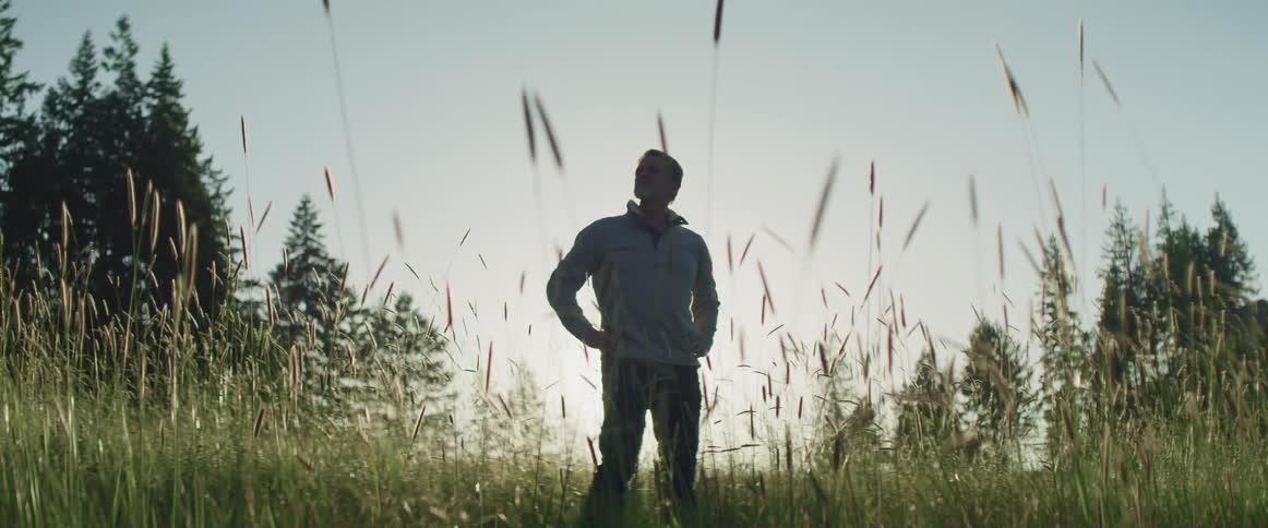 A man is standing outdoors in the daytime