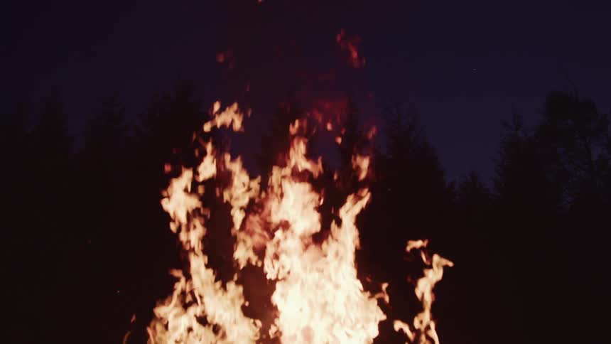 A bonfire outside at night