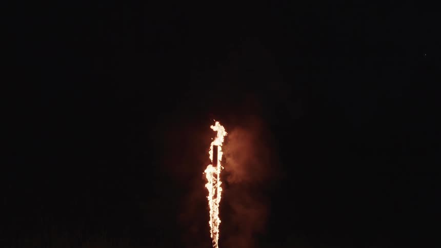 The pole is burning in the dark