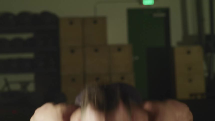 A man is doing push ups in the gym