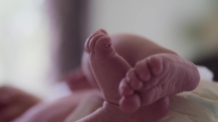 Close up of newborn baby feet