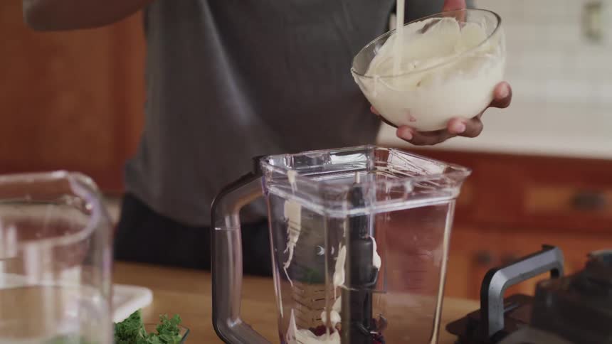 A man is preparing food in his kitchen