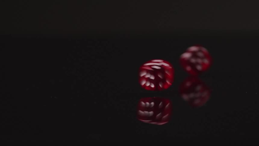 The dice roll on the ground