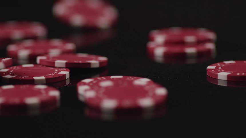 Poker chips falling on a table