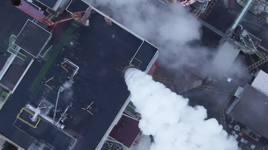 Heavy smoke is rising from the factory chimney