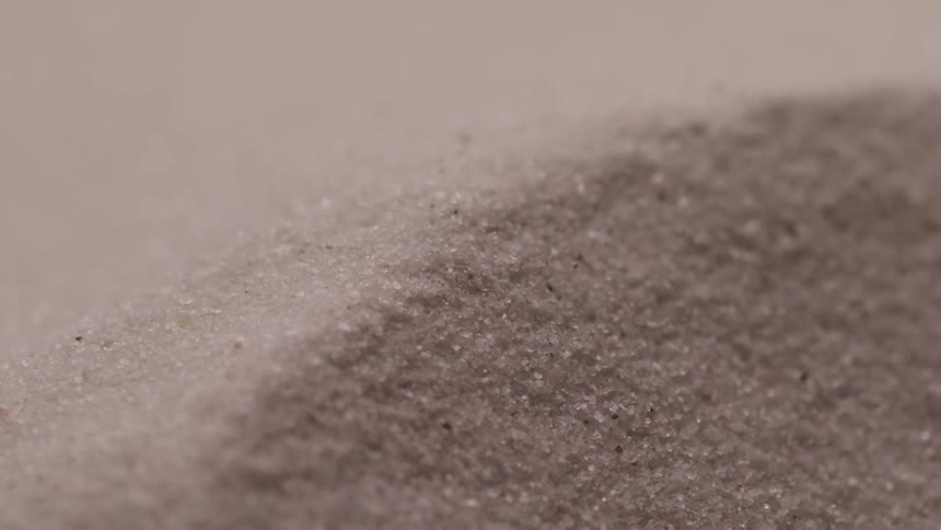 Grains of sand spread out on the ground