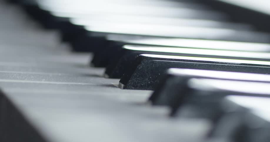 The light is shining on the piano keys