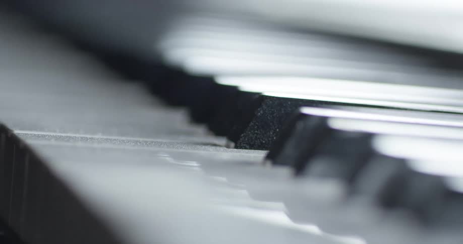 Piano keys are shown close up