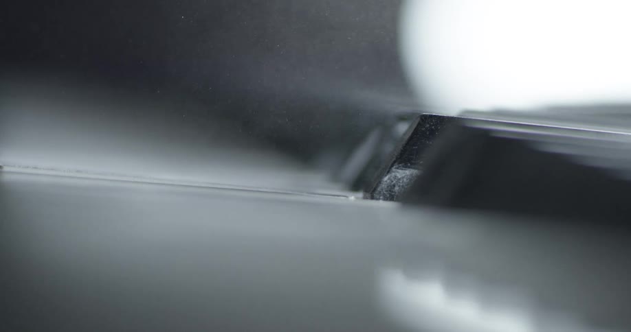 Dust floats over piano keys
