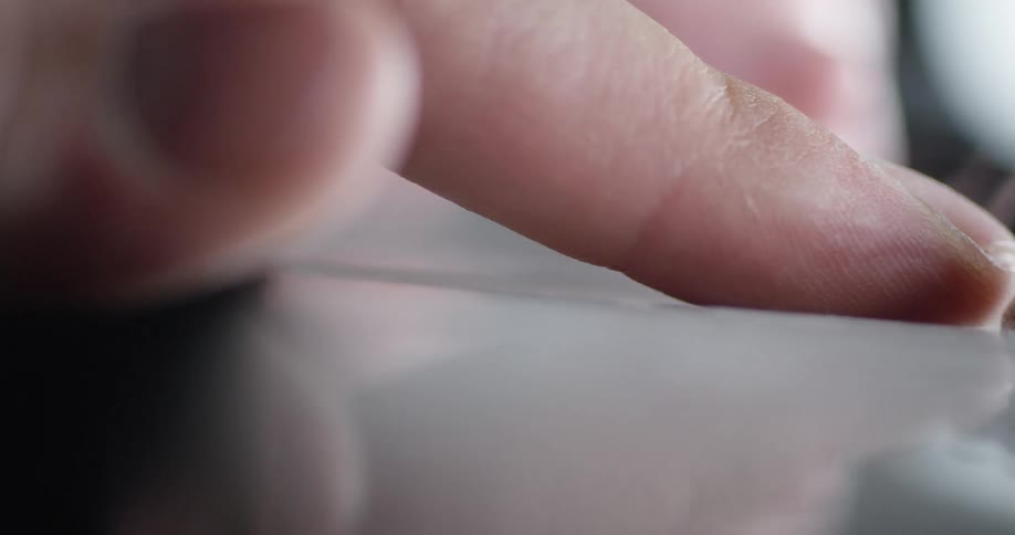 A person is pressing the white keys on the piano