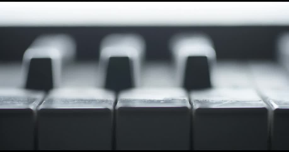 The keys of a piano sit undisturbed