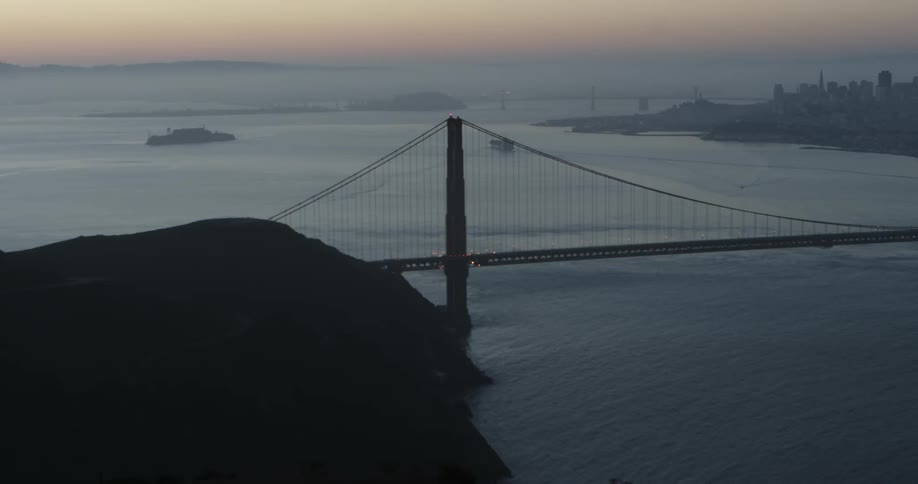A city bridge spans a large body of water