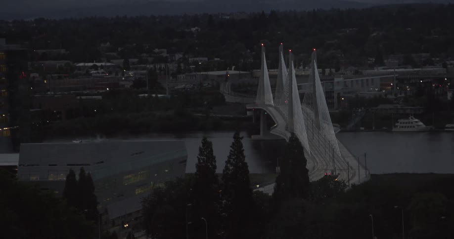 A city bridge spans a river