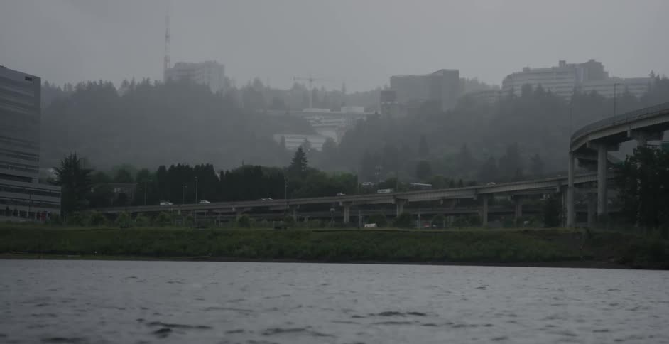 Traffic is seen moving on elevated roadways on the far side of a lake