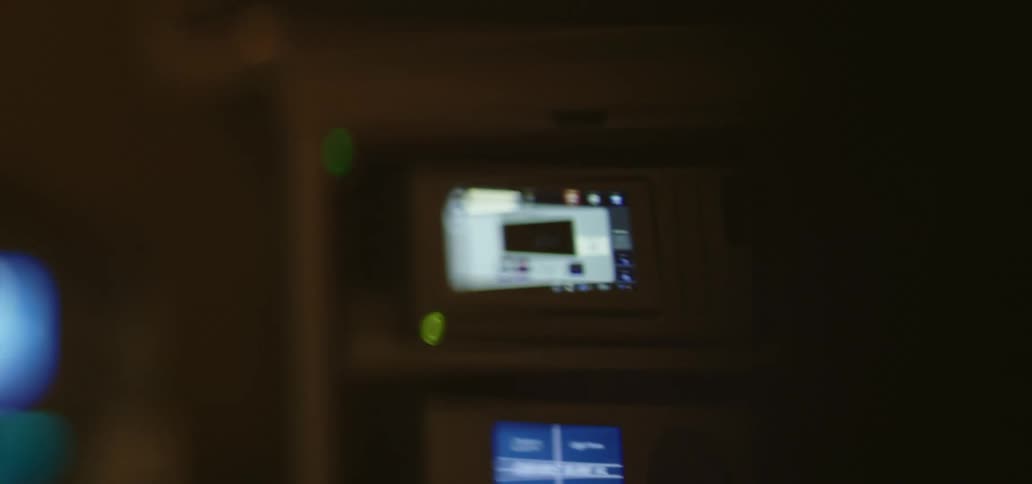 A radio and dashboard lit up in a car