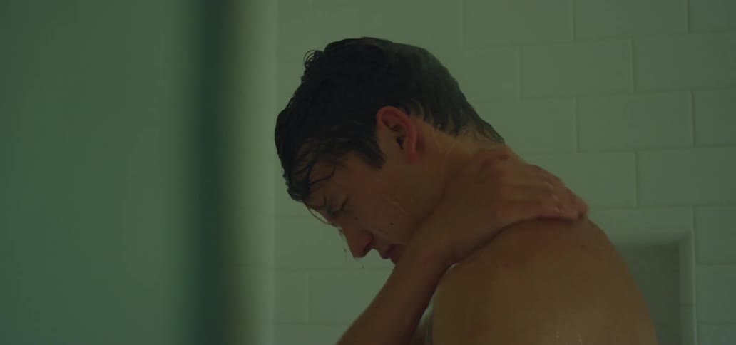 Man has a shower in the bathroom