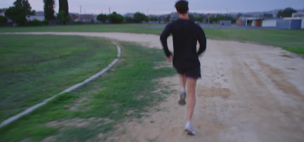 A man is racing around the track