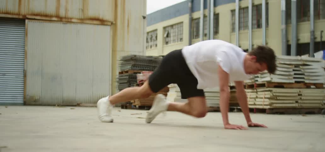 A teenager exercising outside
