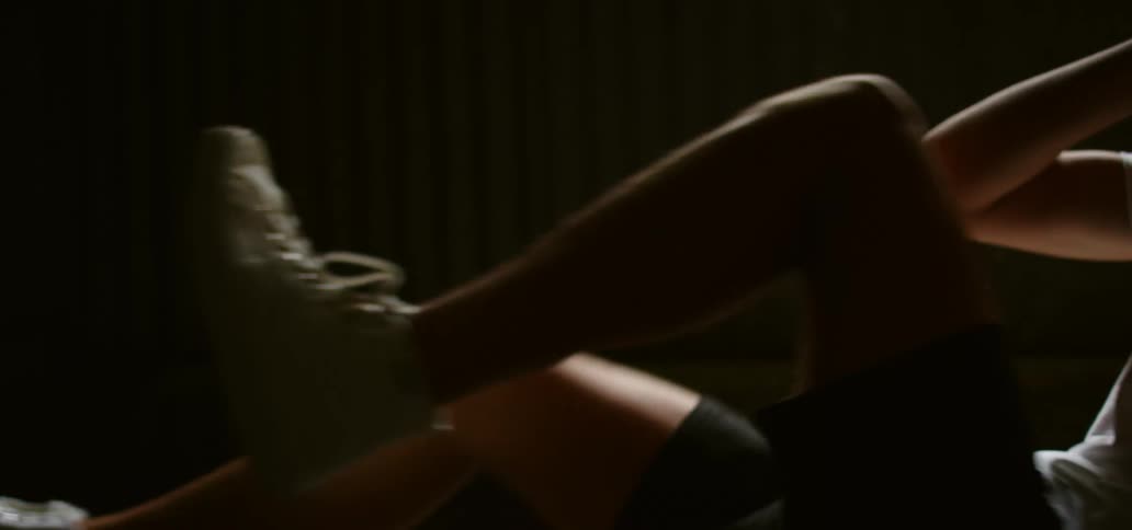 A man is working out in a dark room