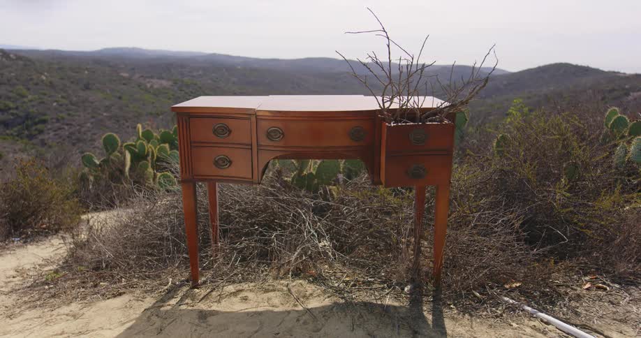 A desk sitting on top of a hill