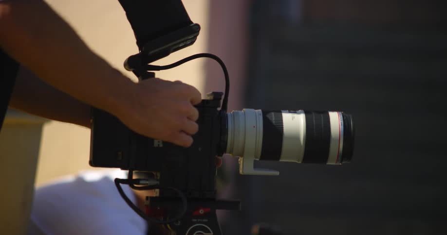 A photographer is setting up a camera
