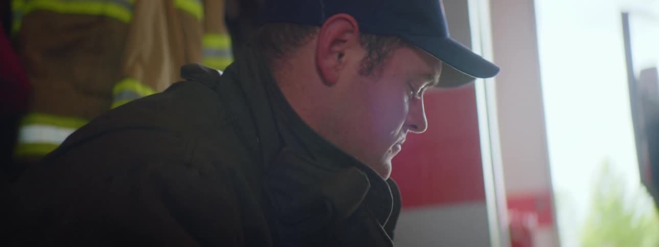 A man is sitting in the firehouse