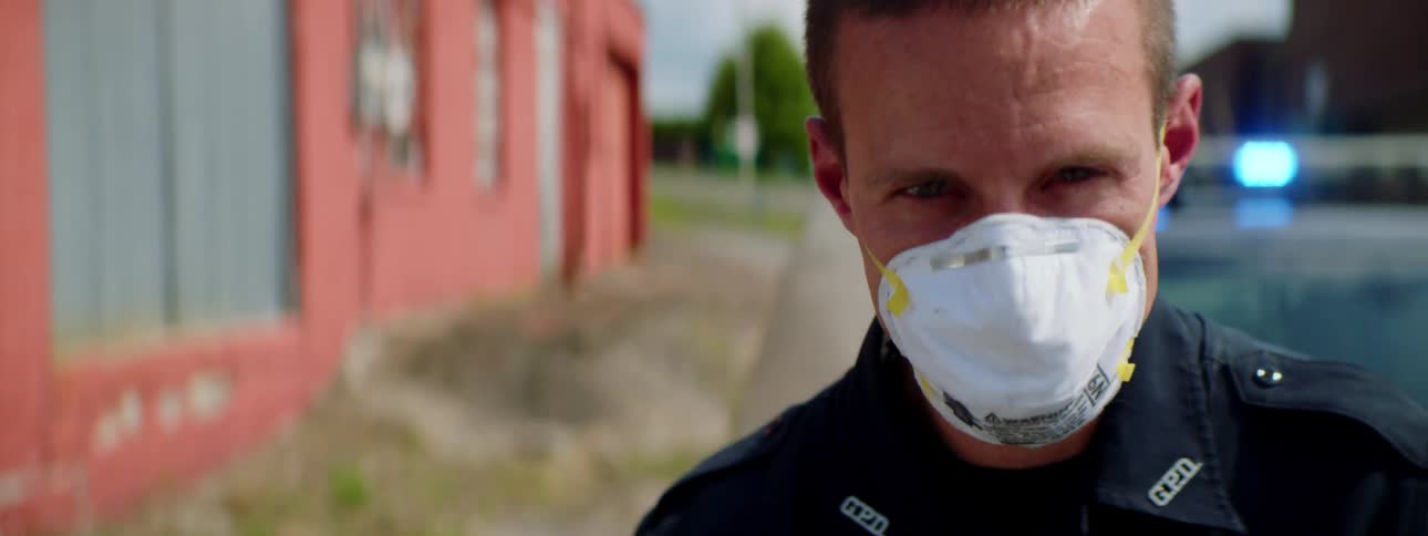 An officer has pulled someone over on the road
