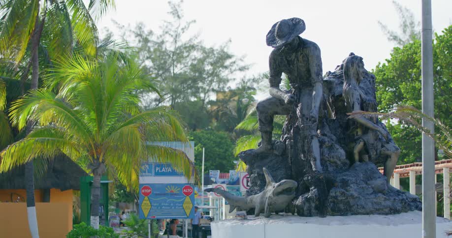 A statue of a man sits in the city