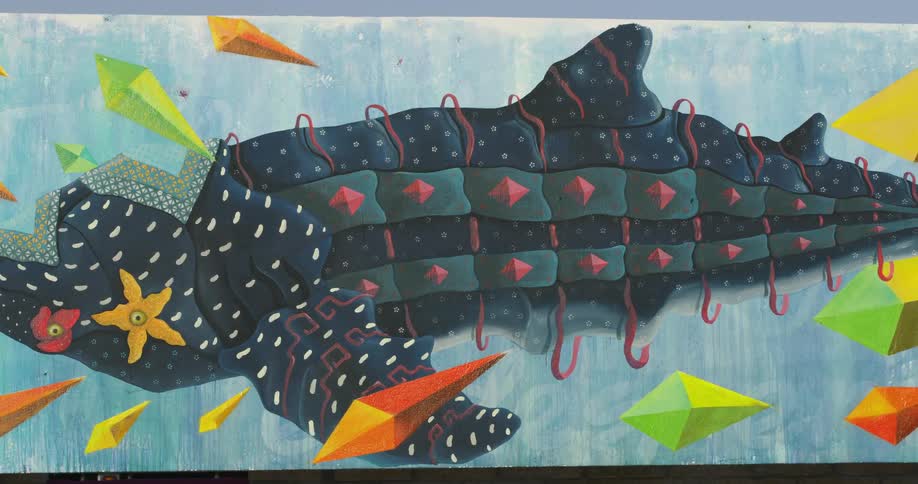 A colorful and modern painting of a whale