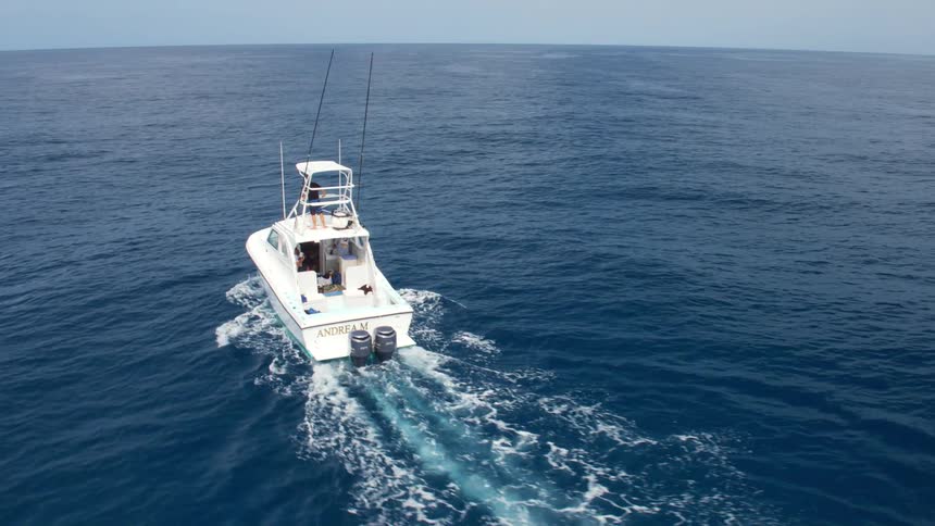 A boat traveling on an ocean