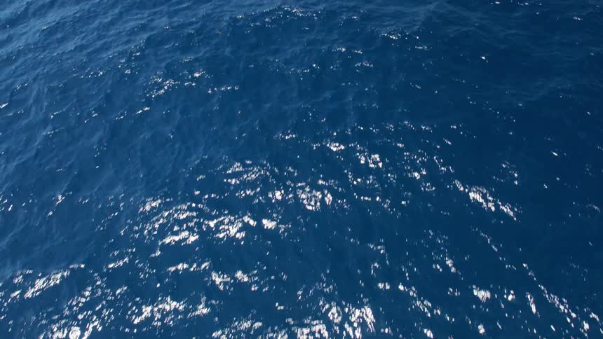 An aerial view of the ocean is displayed