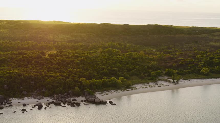 The water is calm around the island
