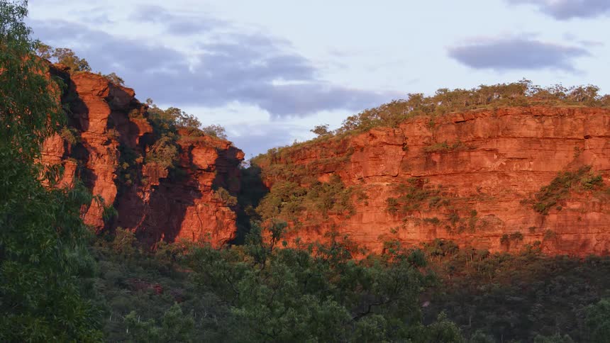 An aerial view of a cliff is displayed