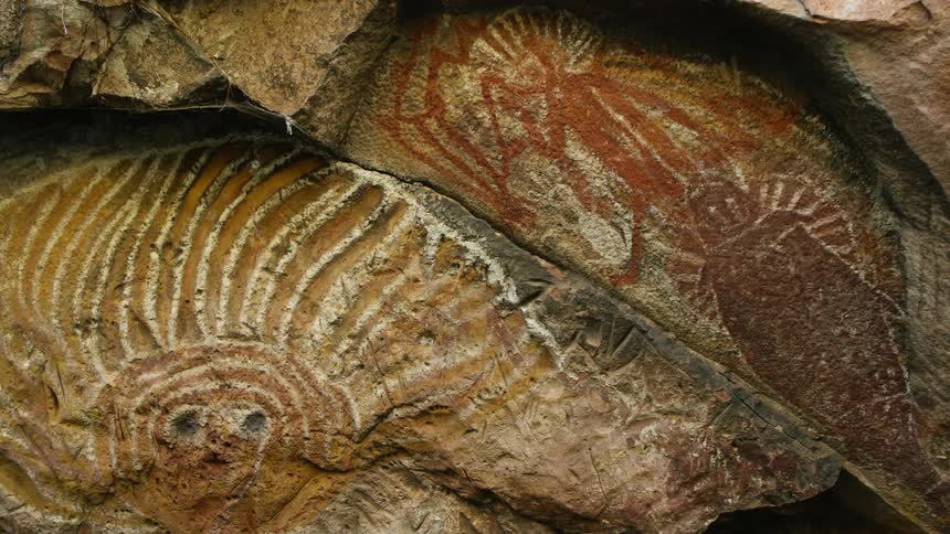 Petroglyphs carved and engraved in the rock surface