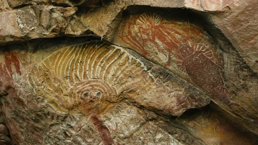 A cave with rocks and rock drawings on it