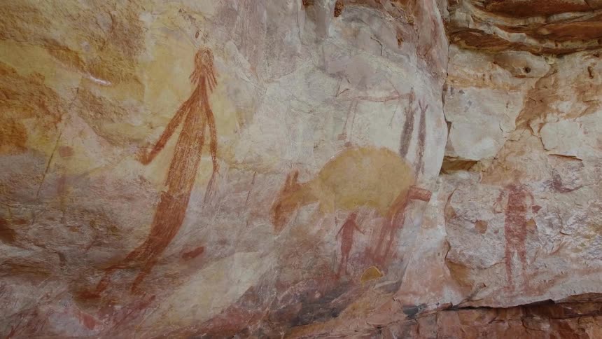 Primitive paintings on a rock formation outdoors