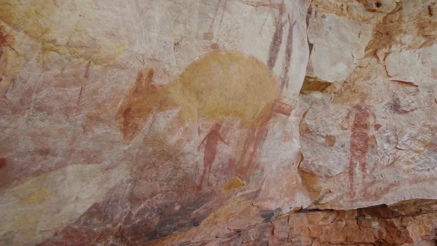 rock painting on a rock wall in the desert