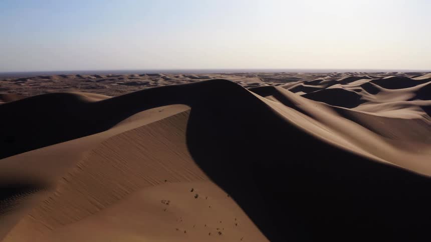 Aerial view of tall dunes in the desert at day