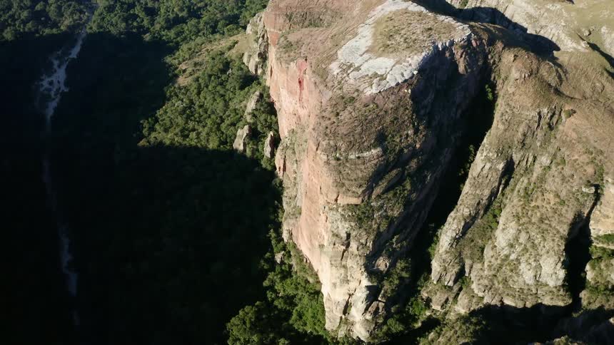 An aerial view of a mountain is displayed
