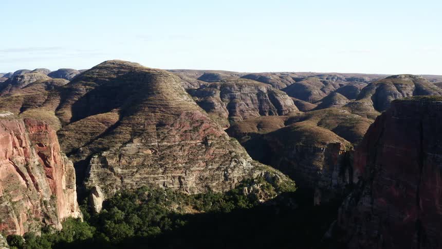 An aerial view of a mountain is displayed