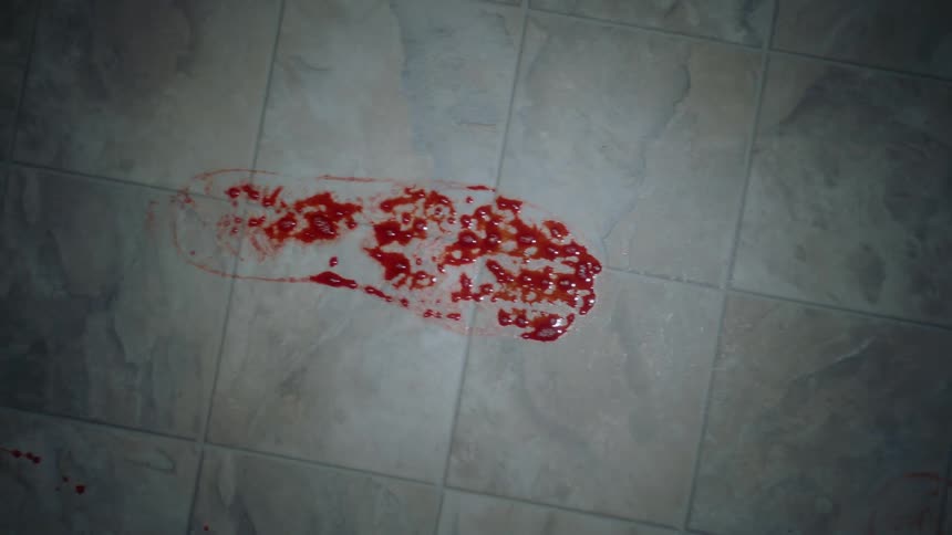 Bloody footprints on a linoleum floor