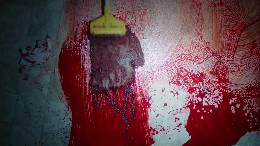 Paint being mopped off a floor
