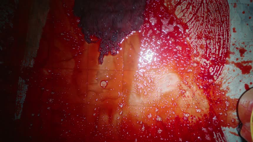 Blood being mopped off a floor